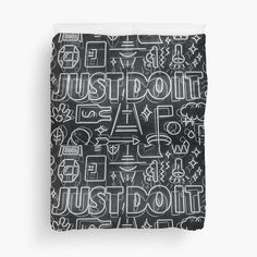 a black and white pattern with the words just do it on it duvet cover