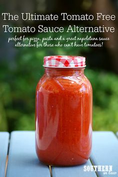 a jar of tomato sauce sitting on top of a wooden table with text overlay reading the ultimate tomato free tomato sauce alternative