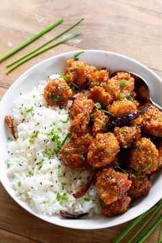 vegan crispy firecracker brussel sprouts with white rice in a bowl