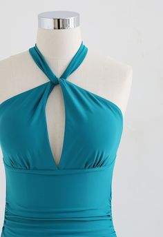 Radiate your sultry temperate in this cutout open back swimsuit, we bet you'll be the beachside's beautiful scenery to others. It features the solid color, cutout at the upper waist, and an almost full open-back design that is just mesmerizing as you are!    - Halter neck  - Cut-out design  - Removable padded cups  - Open back  - Ruched sides  - Hook fastening at neck  - Not lined  - 82% Polyamide, 18% Elasthane  - Wash at 30° C with like color only            Size  Length  Bust  Waist      S  cm  61  84  60-72      inch  24  33  23.5-28      M  cm  62  88  64-76      inch  24.5  34.5  25-30      L  cm  63  92  68-80      inch  24.5  36  26.5-31.5 Solid Color Backless Tankini For Beach Party, Solid Backless Tankini For Beach Party, One-piece Halter Top For Summer Pool, One-piece Halter Top For Poolside Summer, Summer One-piece Halter Top For Poolside, Backless Tankini For Beach Season Party, Turquoise Halter Neck Swimwear For Poolside, Summer Poolside One-piece Halter Top, Solid Color Halter Neck Swimwear For Sunbathing