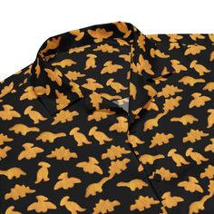 Meet your new favorite summer shirt! It exudes coolness both in terms of style and material. Plus, its featherlight and moisture-wicking material ensures comfort even on the hottest days. Make a statement with the adorable yet super cool dinosaur chicken nuggets.  * 65% recycled polyester, 35% polyester * Fabric weight: 2.95 oz/yd² (100 g/m²) * Breathable and moisture-wicking material * Regular fit * UPF50+ protection This product is made especially for you as soon as you place an order, which i Summer Dinosaur Print Short Sleeve Tops, Casual Dinosaur Print Summer Shirt, Casual Summer Shirt With Dinosaur Print, Summer Dinosaur Print Relaxed Fit Tops, Dinosaur Print Relaxed Fit Tops For Summer, Summer Cotton Shirt With Dinosaur Print, Relaxed Fit Dinosaur Print Top For Summer, Casual Cotton Shirt With Dinosaur Print, Dino Chicken Nuggets