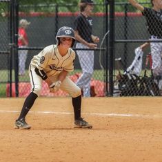 a young baseball player getting ready to catch the ball