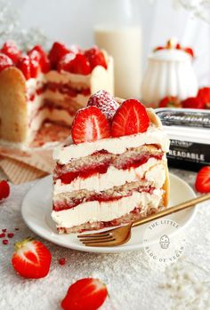 a piece of cake with strawberries on it and a fork in front of it