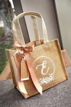 a bag with a bow on it sitting on a table