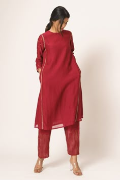 Red kurta with placement floral motif resham work and side seam pockets. Comes with embroidered straight pants.
Components:2
Embroidered
Neckline:Round
Sleeve Length:Three Quarter
Fabric:Chanderi
Color:Red
Side seam pockets
Striped pattern pants
A-line silhouette
 - Aza Fashions Kurtis Ideas, A Line Kurti Designs, A Line Kurti, Red Kurta, Pattern Pants, Resham Work, Kurta Set For Women, Simple Kurta Designs, Kurti Patterns