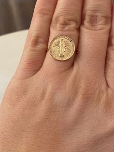 Dainty Round Virgin Mary ring in 14K gold filled. Perfect for a Easter gift! Super dainty and wonderful for everyday wear! RING DESCRIPTION: - Round Virgin Mary charm 14.5mm - gold filled - Skinny gold filled band ring - Sizes 6, 7 and 8 - Handmade and packaged beautifully for you! - - - - - - - - - - - - - - - - - - - - MATERIALS: - 14K Gold Filled: Gold filled jewelry is composed with a layer of solid gold and contains 5% or 1/20 gold by weight. It is thicker than gold plating and is tarnish r Gold Recycled Gold Signet Ring Gift, Gold Nickel-free Promise Ring, Gold 14k Gold Filled Rings For Gift, Gold 14k Gold-filled Rings For Gift, Gold Rings 14k Gold Filled Gift, Nickel-free Yellow Gold Rings For Anniversary, Nickel Free 14k Gold Rings, Gold Engraved Nickel-free Ring For Gift, 14k Gold Filled Tarnish Resistant Midi Rings As Gift