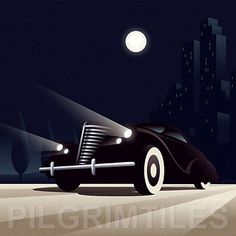 an old fashioned car driving down the road at night with city lights in the background