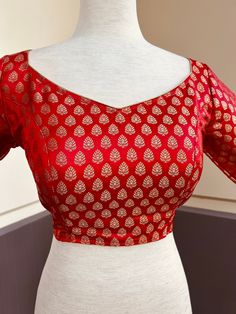 Pure Banarasi Red Color Blouse with small Gold Buttis in Zari Weaving. Comes with Cups attached to the blouse.  Please note : Blouses has margin to open 2 sizes up.  Item : Ready to Wear Blouse Color : Red  Blouse Fabric : Pure Banarasi Silk Blouse Fitting : Princess Cut  Lining : Yes, it is fully lined  Padded or Non-Padded : Padded  Closure: Back Closure with hooks. Ready-to-Wear : Yes Disclaimer - : -This is a Standard Size blouse. We do not guarantee perfect fit as every body and shape is di Blouse Fitting, Princess Cut Blouse Design, Plain Blouse Designs, Banarasi Blouse, Princess Cut Blouse, Latest Model Blouse Designs, Color Blouse, Blouse Hand Designs, Blouse Models