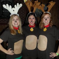 three women dressed up as reindeers posing for the camera