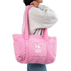 Our Candy Tote Bag is a cozy and stylish bag that combines every-day convenience with a classic design. It features 3 exterior pockets, and a bow for an added touch of elegance.   The quilted pink terry exterior is thick and luxurious, complemented by the matching pink gingham interior.   Ideal for carrying books and groceries, or hauling beach gear and gym clothes, this bag is a must have for anyone who values versatility.   Size: 16.5" x 12" x 5" (42cm x 30cm x 12cm) Gingham Interior, Mini Makeup Bag, Pink Gym, Luxury Tote Bags, Large Makeup Bag, Oversized Pants, Inside My Bag, College Fits, Vanity Bag