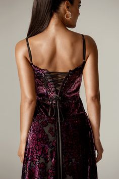 Our spring collection is full of elegant styles and 'Victoria' is one of the most striking. we're loving the corset inspired lace up back for a vintage feel. It's cut from an ultra luxurious velvet so it feels rich and sumptuously soft. in a purple hue, embellished with floral blooms. 'Victoria' has boning for a flattering bust with delicate shoulder straps. The bodice has a curved hem that sits below the natural waistline and the skirt skims over the hips, falling freely to a floaty finish. It' Rose Velvet, Velvet Maxi, Velvet Maxi Dress, Elegant Styles, Romantic Dates, Purple Hues, Rose Print, Spring Collection, Elegant Fashion