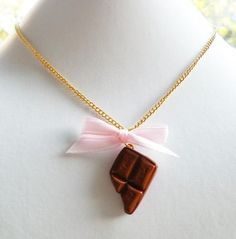 "Cute chocolate bar and pink ribbon necklace. This sweet piece of candy is made of strong polymer clay. ♥ 100% Handmade with polymer clay ♥ Comes on a 18\" gold-plated necklace ♥ Always gift wrapped ♥ ♥ Check out my other items: BabyLovesPink.etsy.com Follow Baby Loves Pink on: Instagram @babylovespink Facebook.com/babylovespink Thank you for visiting Baby Loves Pink! © Baby Loves Pink" Chocolate Accessories, Chocolate Necklace, Matching Necklaces For Couples, Cute Chocolate, Photo Locket Necklace, Ribbon Necklace, Bow Necklace, Couple Necklaces, Photo Locket