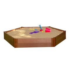 an empty sandbox with toys in it