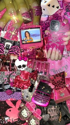 a pile of assorted pink and black items with a cell phone in the middle