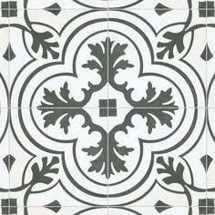 a black and white tile with an ornate design