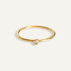 Introducing our dainty Solitaire Ring, crafted with 18k gold filled material for a touch of luxury. This everyday ring is perfect for adding some sparkle to your every day look. ∙ D E T A I L S ∙- 18k Gold Filled - Sizes range from 5 - 10∙ G O L D ∙ F I L L E D ∙ Gold-filled components contain 100+ times more real gold than gold-plated components and are both durable and tarnish resistant. It is more affordable and accessible than solid gold but higher quality than gold plated. Luxury Tarnish-resistant Rose Gold Rings, Luxury Rose Gold Tarnish Resistant Rings, Gold Ring With Single Diamond For Everyday, Everyday Gold Ring With Single Diamond, Gold Diamond Ring With Single Diamond For Everyday, Everyday Gold Diamond Ring With Single Diamond, Everyday Gold Solitaire Birthstone Ring, Simple Gold Solitaire Midi Rings, Dainty Gold Solitaire Midi Rings