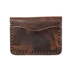 Modern aesthetics meets old-school style in this Leather Wallet.When you slip our 5 Card Wallet into your pocket, it almost feels like nothing is there. Your wallet will gather compliments from friends and earn patina the more you use it. From the intoxicating leather aroma to our attention to detail it will be hard to put this wallet down.Our full-grain leather means your wallet will develop character and patina. We hand-sew this wallet with thick Tiger Thread so it will never unravel or come a Vintage Brown Bifold Wallet With Coin Pocket, Vintage Leather Wallet With Waxed Finish, Vintage Leather Wallets With Waxed Finish, Vintage Brown Bifold Wallet For Everyday Use, Vintage Brown Bifold Wallet, Vintage Wallet With Coin Pocket For Everyday Use, Vintage Brown Bifold Wallets With Card Slots, Vintage Brown Bifold Wallet With Card Slots, Vintage Brown Bifold Wallet With Interior Card Slots