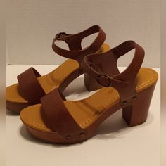 New Without Tags, Size 7, Soda Platform Sandals. Cute Rivet Detail. 3 1/2" Heel. Never Worn. No Wear On Soles. Original Box Not Available. Brown Ankle Strap Sandals With 4-inch Heel, Brown Open Toe Block Heels With Buckle, Brown Open Toe Block Heels With Heel Loop, Brown Open Toe Block Heels With Buckle Closure, Adjustable Open Toe Sandals With 4-inch Heel, Brown Block Heels With Buckle And Open Heel, Brown Open Heel Block Heels With Buckle Closure, Brown Stacked Heel Heels, Brown Open Toe Block Heels With Removable Insole