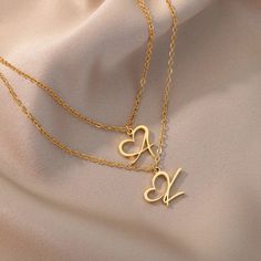 Introducing our Heart Initial Letter Necklace, a timeless and personalized piece of jewelry that beautifully captures the essence of love and individuality. This exquisite necklace features a delicate and intricately designed initial, with a charming heart delicately positioned beside it.Whether it's a gift for yourself or a loved one, the Heart Initial Letter Necklace is a cherished keepsake that symbolizes the profound connections we share with others. Wear your own initial or that of a specia Dainty Personalized Heart Necklace With Initial Pendant, Dainty Personalized Initial Heart Necklace, Dainty Personalized Heart Necklace With Initial, Valentine's Day Dainty Heart Initial Pendant Necklace, Valentine's Day Gift Charm Necklace With Initial Pendant, Valentine's Day Initial Pendant Charm Necklace Gift For Her, Valentine's Day Gift Initial Pendant Charm Necklace, Initials Pendant Necklace For Mother's Day, Dainty Initial Pendant Charm Necklace For Valentine's Day