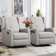 two reclining chairs sitting next to each other in a living room