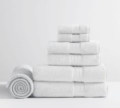 a stack of white towels sitting next to each other