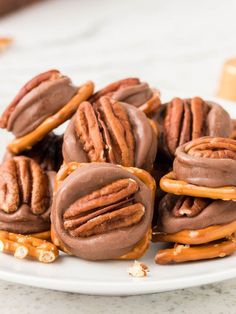 chocolate pretzels with pecans and caramel drizzled on top