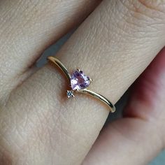 This 14K Pink Sapphire Heart ring makes for a perfect promise ring, or as a gift for your beloved. Nothing like saying "I love you" with this dainty beauty top with a natural white diamond. Perfect to wear alone or stacked with other ring bands. Available in 14k yellow gold, rose gold, and white gold. Pair it with our Siren Marquise ring or Winter Palace Marquise ring (as pictured) for the ultimate majestic look. This ring is designed and made in NYC. 14K solid gold band Natural pink heart sapph Dainty Diamond Birthstone Ring For Proposal, Rose Gold Diamond Heart Ring For Proposal, Dainty 14k Gold Birthstone Ring For Proposal, Rose Gold Solitaire Heart Ring For Promise, Dainty Birthstone Ring For Proposal, Dainty Rose Gold Heart Ring For Proposal, Delicate Rose Gold Heart Ring, Rose Gold Diamond Heart Ring For Promise, Heart-shaped Rose Gold Diamond Ring For Proposal