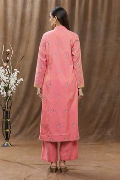 Pink chanderi kurta with multicolor floral embroidery and chevron pattern on the hems. Comes with straight pants and woven dupatta.
Component: 3
Pattern: Embroidery
Type Of Work: Thread
Neckline: Band
Sleeve Type: Full
Fabric: Chanderi
Color: Pink
Other Details: 
Dupatta with woven motifs
Side slits
Pant with pleats
Occasion: Puja - Aza Fashions Kurta Pant Set, Pink Thread, Pattern Embroidery, Kurta With Pants, Fashion App, Chevron Pattern, Pant Set, Straight Pants, Set For Women