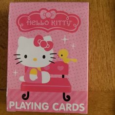 a hello kitty playing card on a table