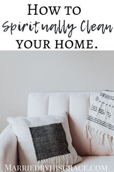 a white couch with a black and white throw pillow on it, the text reads how to spiritfully clean your home