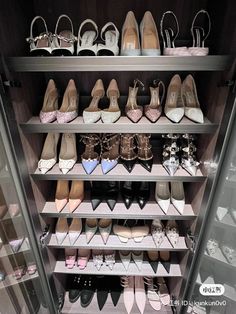 a closet filled with lots of different types of shoes