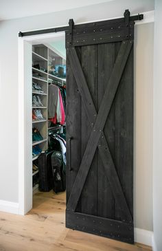 an open sliding barn door in a bedroom