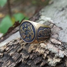 The custom signet rings are made to order from Italian bronze, silver plated bronze or silver 925 solid. The ring based on ancient artifacts with image of Odin's Ravens and image of warrior found on armour plates. This ring will be perfect for men and women who likes Norse mythology, Viking jewelry or Scandinavian Pagan aesthetics. The ring shipped in wooden jewelry gift box. approximate weight: 19 gm | 0.67 oz Norse Raven, Raven Ring, Viking Artifacts, Odin's Ravens, Custom Signet Ring, Magic Items, Boys Jewelry, Jewelry Men, Signet Rings