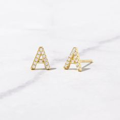 Dainty Initial Stud Earrings set with Pave Stones. Super cute! - - - D E T A I L S - - - * Made of 925 Sterling Silver * THICK plating of 14k Gold * Sold as PAIR * Nickel-free & Hypoallergenic * Measures 7mm in length (can vary slightly by Letter) * Made with highest grade cubic zirconia for an authentic diamond look! Made with 100% Pure Love! ♡ Happy to answer any questions you may have! Letter Earrings Initials, Layering Diamond Necklaces, Initial Stud Earrings, Initial Earrings Studs, Monogram Earrings, Letter Earrings, Initial Earrings, Sell Gold, Initial Jewelry