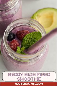 berry high fiber smoothie in a mason jar with mint leaves and raspberries