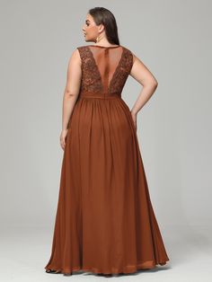 a woman in a long brown dress with an open back and lace detailing on the top