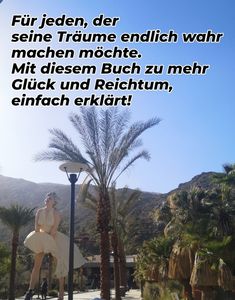 a woman sitting on top of a lamp post next to palm trees