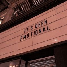 a sign that says it's been emotional on the side of a building