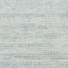 a blue and white rug with small squares on the top, in different sizes and colors