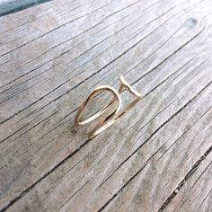 "Simple chic minimalist double U shaped open line ring designed to make a statement in a minimalistic-ally tasteful way. Great everyday ring that is made with sturdy but feminine 16 gauge wire of your choice. The pictured ring is made with luminously shiny 14k yellow gold fill. Each ring is made to your selected size and finished off in your selected finish preference, the pictured finish is bright polished. The loops of this ring will slightly vary depending upon the size of the ring unless oth Modern Adjustable Initial Ring With Open Design, Modern Adjustable Initial Open Ring, Minimalist Metal Initial Open Ring, Minimalist Open Initial Ring For Promise, Minimalist Open Initial Ring, Everyday Open Ring With Initial In Simple Design, Adjustable Simple Initial Open Ring, Modern Rose Gold Initial Open Ring, Modern Rose Gold Open Initial Ring