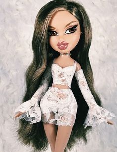 a close up of a doll with long hair and laces on it's body