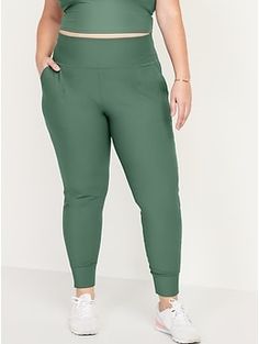 "Power up your workout with PowerSoft joggers.  Light compression fabric meets a ridiculously smooth, peachy-soft feel.   Elasticized high-rise waistband, with light-reflecting Old Navy Active logo at center back.  Diagonal on-seam hip pockets.  Band Stretch Workout Pants With Elastic Cuffs, Green Joggers With Elastic Waistband For Workout, Stretch Sports Bottoms With Elastic Cuffs, Casual Workout Bottoms With Wide Waistband, Casual Mid-rise Activewear With Pockets, Stretch Bottoms With Elastic Cuffs For Sports, Versatile Joggers With Side Pockets, Versatile Solid Joggers With Side Pockets, Casual High Waisted Joggers For Workout