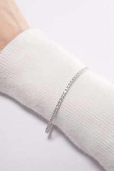 PLX487 Our 2.1mm Lab Rectangle Cut Tennis Bracelet is meticulously handcrafted in Korea, delivering a unique blend of classic and contemporary aesthetics. Made from 14K solid white gold, this bracelet features a tennis design adorned with lab-created rectangle cut stones, providing a timeless and elegant look. This bracelet is perfect for adding a touch of elegance and sparkle to your everyday look or for special occasions. This tennis bracelet also makes a great gift for occasions like birthday Minimalist Stackable White Gold Diamond Bracelet, Minimalist White Gold Stackable Diamond Bracelet, Minimalist White Gold Bangle For Everyday Luxury, Stackable White Gold Diamond Bracelet For Everyday Luxury, Luxury White Gold Bangle For Everyday, Elegant White Gold Tennis Bracelet For Everyday, Everyday Luxury Stackable White Gold Diamond Bracelet, Minimalist White Gold Jubilee Bangle, Elegant Everyday White Gold Tennis Bracelet