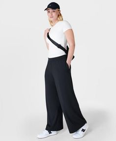 Our super comfortable trousers for luxe lounging. Soft, sustainable fabric made from plant-based modal Lenzing™ yarn. Effortless pull on design and a relaxed wide leg fit. Wear high rise or with the wide waistband folded down. 2 subtle slip pockets at the hips. Rise length for size S: 9" / 23cm. Inseam length: 29" / 73cm.. Model wears size S and is 178cm/5'10"tall. Style Code: SB8238Colour: Black Versatile Relaxed Fit Yoga Pants For Lounging, Versatile Ankle-length Wide Leg Pants, Versatile Yoga Pants For Spring Loungewear, Spring Yoga Pants For Loungewear, Versatile 4-way Stretch Sweatpants For Loungewear, Versatile Yoga Pants For Lounging, Wide Leg 4-way Stretch Yoga Pants For Loungewear, High-waisted Wide Leg Pants With Elastic 4-way Stretch, Casual Modal Wide Leg Bottoms