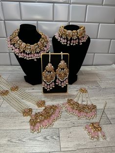 Noor Bridal Set! Classic Desi Bridal Set.  Comes with Tikka, Earrings, Choker, Necklace long beaded Mala, and Jhoomar.  Wedding Bangles are available in 2.6 if other size is needed let me know.  Classic Pakistani/Indian Bridal Jewelry.  Beautiful Color in Gold with champagne stones and maroon beads.  We also have Mint set and Pink Set Available for Brides. Perfect for upcoming wedding season.  Bridal Jewelry, Engagement Jewelry.  Set with Bangles: $300  Without Bangles: $275  Shipping to all cou Traditional Pink Bridal Necklace, Desi Bridal Jewelry Gold And Pink, Heavy Pink Kundan Bridal Necklace, Festive Heavy Pink Bridal Necklace, Heavy Pink Bollywood Jewelry, Bridal Jewellery Indian, Engagement Jewelry, Mala Beads, Wedding Jewelry Sets