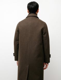 A relaxed fit overcoat made from a high density melton wool/nylon fabric. fully lined with quilted polyester taffeta and 100% recycled vegan down fill. details include large flap pockets at the waist and italian horn buttons.    - made in usa  - 90% wool 10% nylon  - relaxed fit  - dry clean  - kim is 5'11” 155lbs and wears size medium Khaki Wool Pea Coat For Winter, Business Wool Outerwear In Khaki, Winter Wool Pea Coat In Khaki, Khaki Wool Long Coat, Classic Wool Khaki Outerwear, Classic Khaki Wool Outerwear, Classic Khaki Wool Pea Coat, Khaki Wool Pea Coat With Pockets, Italian Horn