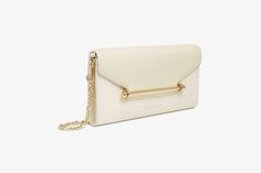 Understated and elegant, our best-selling Multrees Chain Wallet is the perfect day-to-evening companion. Handcrafted in Spain, this versatile purse can also be carried as a timeless clutch or transformed into a crossbody bag with its removable gold chain strap. The magnetic closure, decorated with our signature Strathberry music bar, keeps your essentials secure and opens to reveal a surprisingly spacious interior - featuring 8 card slots and a zipped pocket with a leather pull. Modern Wallet On Chain For Formal Occasions, Elegant Everyday Clutch Shoulder Bag, Modern Formal Wallet On Chain, Luxury Envelope Shoulder Bag With Chain Strap, Gold Rectangular Wallet On Chain With Detachable Strap, Elegant Everyday Wallet On Chain With Chain Strap, Classic Evening Wallets With Detachable Strap, Gold Wallet On Chain With Detachable Strap, Classic Gold Wallet On Chain For Formal Events