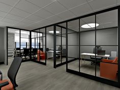 an office with glass partitions and orange chairs in front of the desks on each side