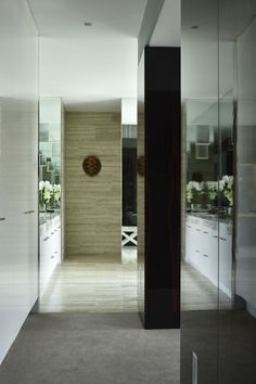 the interior of a modern house with glass walls