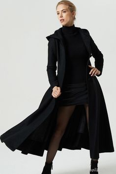 "Stay warm and look great with this long black dress coat. The maxi coat make up wool blend fabric and polyester, and the wool swing coat features a single breasted design with a fit and flare silhouette, finished with a warm hood, and fitted waist, this cozy coat loos great layered over dress for a stylish ensemble, it should one in your wardrobe. ** Detail ** * 45% wool, + polyester,fiber * Polyester lining * Hooded neck * Button fastening through the front * Seam pockets * Stitched panel deta Black Wool Coat Women, Dress Coat Outfit, Wool Maxi Coat, Black Dress Coat, Womens Tunic Dress, Hooded Wool Coat, Trendy Coat, Black Wool Coat, Long Wool Coat